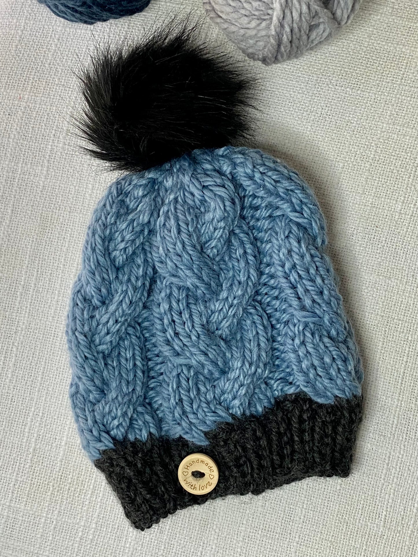 Cozy Cables Hat in Faded Denim and Raven- Recycled Synthetic Fiber blend